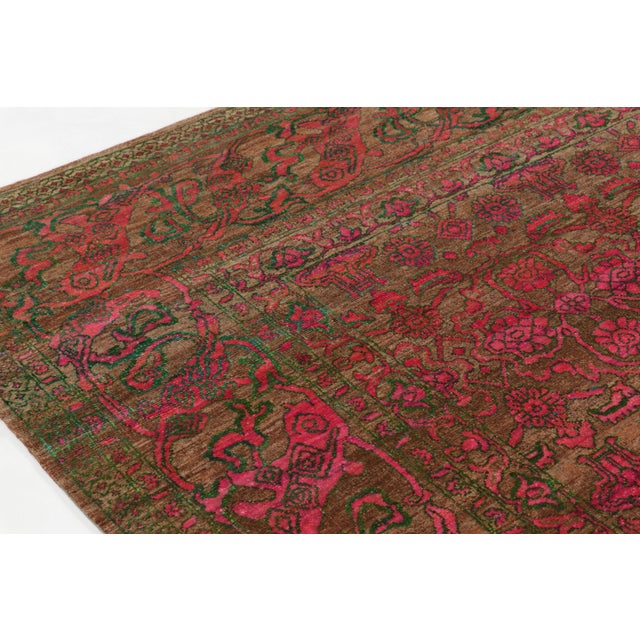 Hand-knotted in premium wool, this oversized 10x14 contemporary Agra-inspired rug reinterprets a classic floral design...