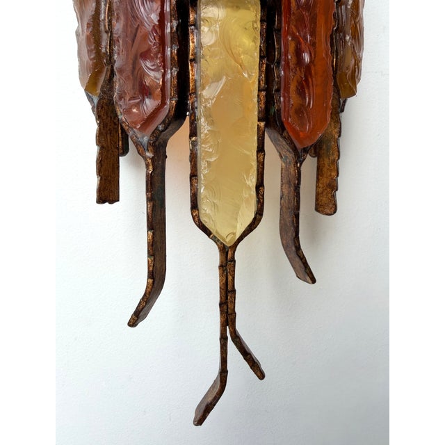 Pair of Mid-Century Modern wall lamps light sconces in red, yellow and amber hammered glass and wrought iron, gilding gold...