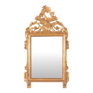 Vintage Italian Made Louis XVI Style Carved Giltwood Mirror With Elaborate Floral Crest For Sale