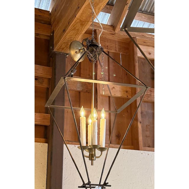 Beautiful metal box kite lanterns made by hand in Texas. There is no glass in the panels - just the beautiful shape forged...