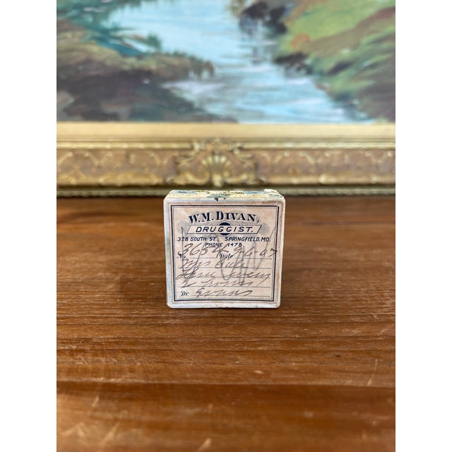 This small antique apothecary box dates to 1907 and originates from the pharmacy of W.M. Divan, Druggist, located at 328...