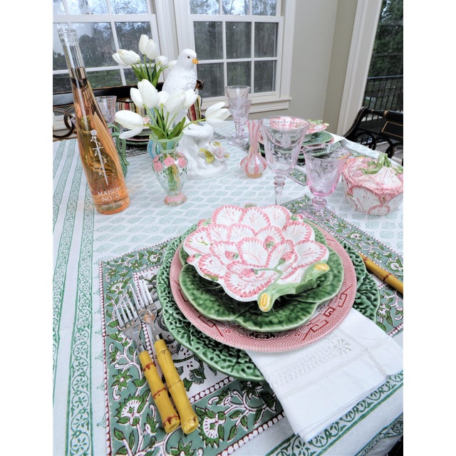 This is a beautiful set of Majolica dishes made in Portugal. They are pink, white and green with vines of green and small...