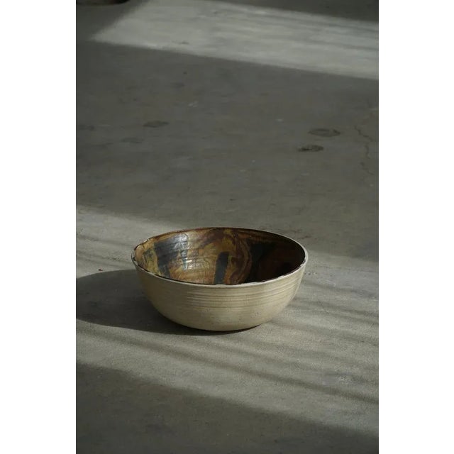 A large handcrafted ceramic bowl designed by nils kähler, part of the renowned kähler keramik workshop in denmark. The...