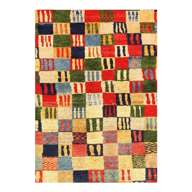 Gabbeh rugs are made by the nomadic Qashqai tribes of southern Iran. They are rough cut and long piled rugs of rich color...