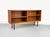 Minimalist open sideboard, divided into two sections, each with an adjustable shelf. High-quality Danish production by...
