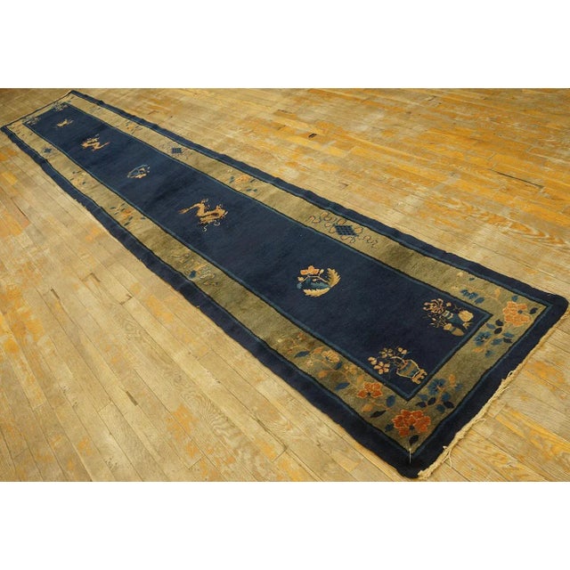 Antique Chinese Peking rug, size:2' 4'' x 14' 4''. Chinese - Peking The commercial Peking carpet is a later 19th century...
