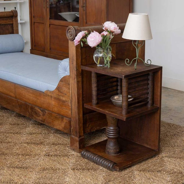 Beautiful pair of carved wood end tables by Charles Dudouyt from France, 1940s. Ornately carved slat and column detail...