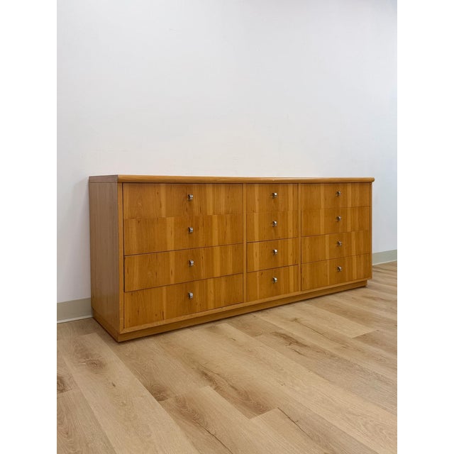This handsome vintage Founders Furniture Company blonde 12-drawer dresser is a substantial and collectible mid-century...