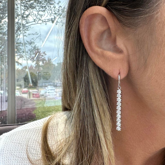 Gender: Ladies Metal Type: 14K White Gold Length: 1.50 inches Weight: 4.75 grams One pair of ladies 14K white gold diamond...