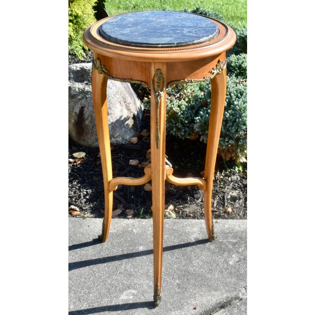 Vintage (1970's) Round Table Stand/Plant Stand has a French Style. Fruitwood with a Marble Top and Decorative Bronze...