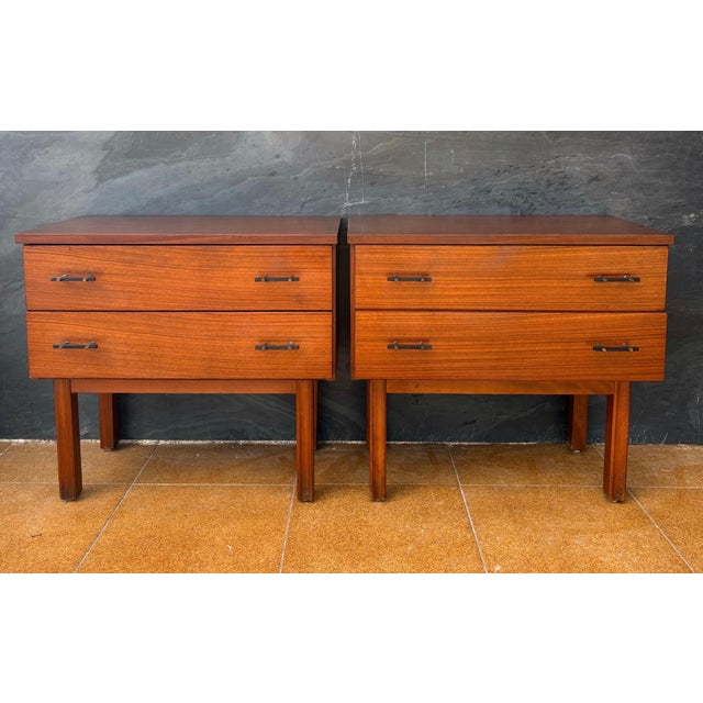 Pair of Scandinavian Mid-Century Modern nightstands crafted in teak, dating to the 1960s. Each piece features a clean...