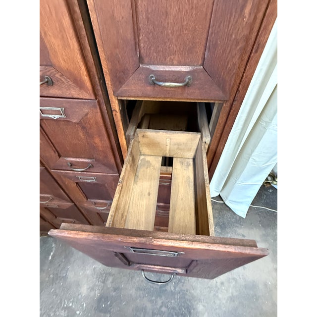 A striking and increasingly rare antique Belgian oak file cabinet, dating to circa 1920 and crafted by Hubert Degee-Fabry...