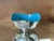 Striking vintage Heirloom silver-plated bowl featuring a polished exterior contrasted by a vibrant turquoise blue enamel...
