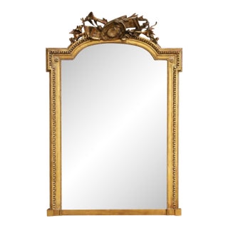 19th Century French Louis XVI Giltwood Mantel Mirror With Musical Trophy Crest For Sale
