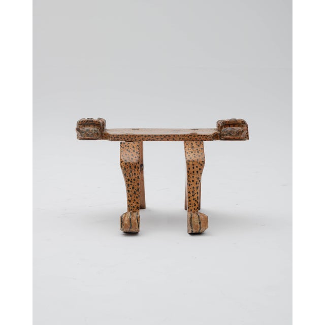 A ritual stool adorned with jaguar effigies, crafted in the style of pre-Columbian ceremonial pieces from the South...