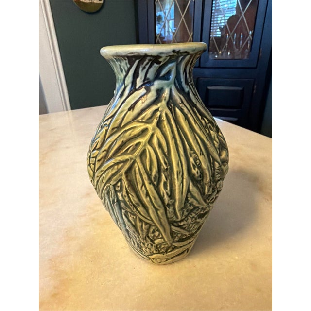The Antique Weller Marvo 1920s Art Deco Pottery Green Palm Frond 7" Vase is a vintage piece of North American pottery from...