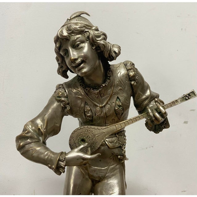 Superb and important pair of silvered bronze sculptures signed A.L. Gaudez, depicting a troubadour musician and an elegant...