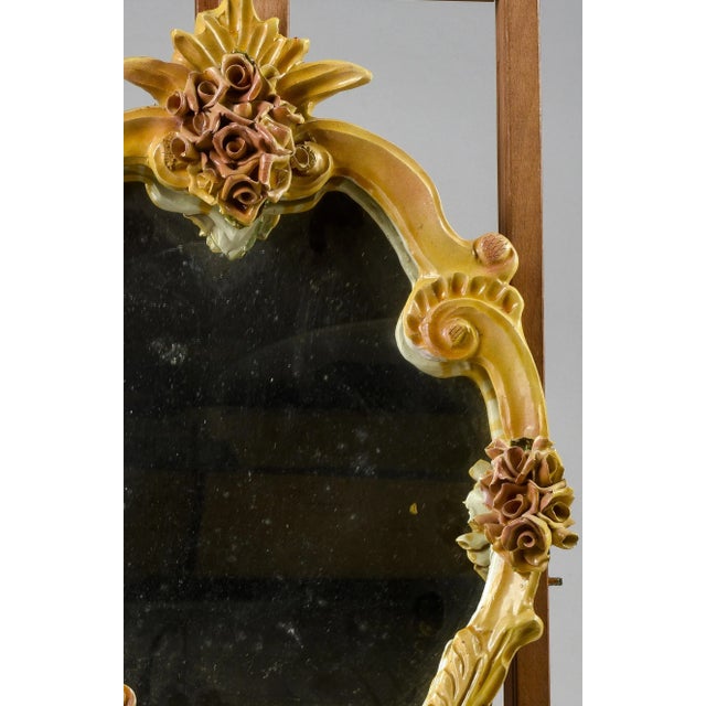 Mirror with hand-painted ceramic Italy in 1980 decorated with flowers in relief applied to move the frame and processed...
