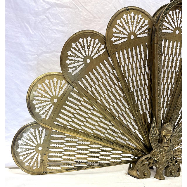 Stunning Art Deco/ Hollywood Regency style fireplace screen from the 1950's. It has a unique 'peacock' design with nine...