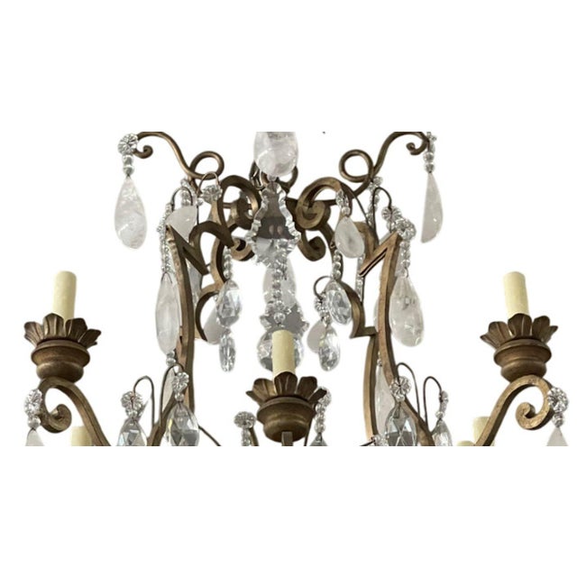 An exquisite 20th century Italian chandelier adorned with an abundance of natural rock crystal drops. This elegant fixture...