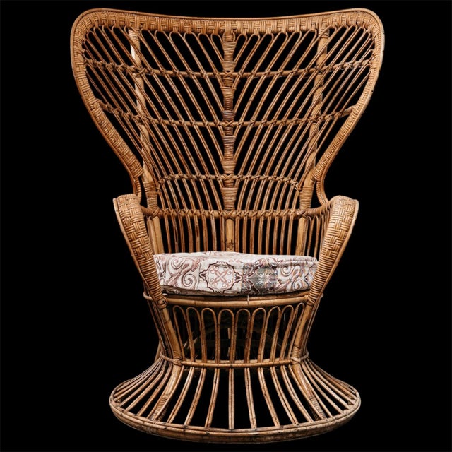 Elevate your space with this stunning Midcentury Modern rattan armchair, a true masterpiece of 1950s Italian organic...