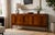 A mid century mahogany sideboard from Greaves and Thomas, circa 1960s There are two cupboards each has a shelf, one is...