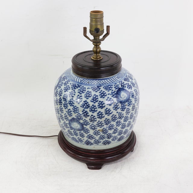 This antique table lamp is expertly crafted from an authentic blue and white porcelain ginger jar. The traditional...