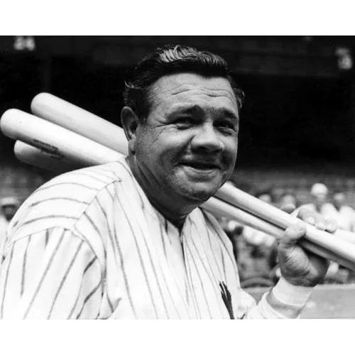 Babe Ruth with Baseball Bats "Great black and white action shot of Babe Ruth on the field, bats thrown over his shoulder...
