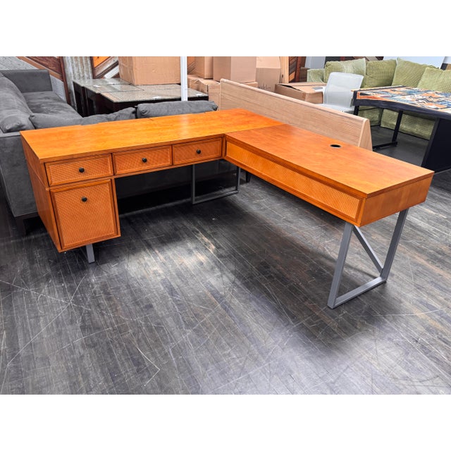 Design Plus Gallery presents the Nusaiba L-Shaped Lift-Top Cane Executive Desk from Inbox Zero Furniture. This desk has an...