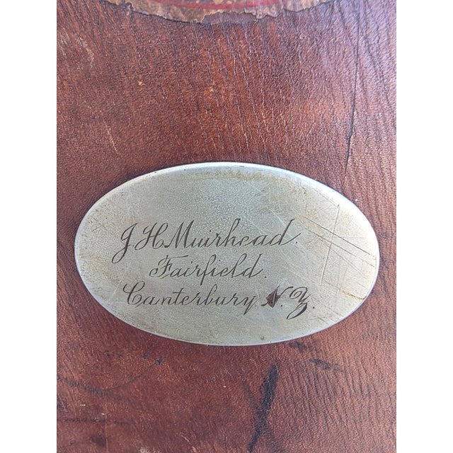 Antique leather suitcase with engraved metal name plate. This is in bad condition and is only good for decoration.