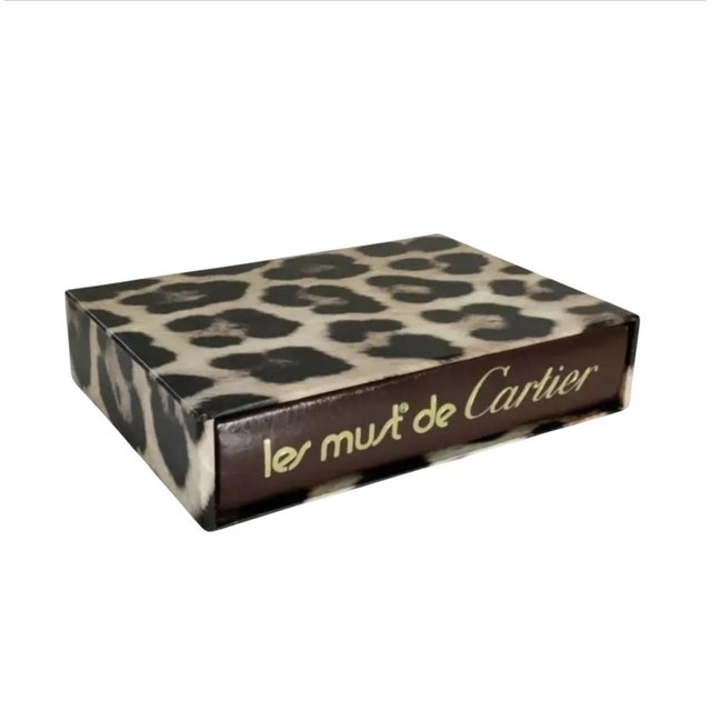 For your consideration . . . A fabulous Cartier book entitled: LES MUST de CARTIER. This book is gorgeous! The hardcover...