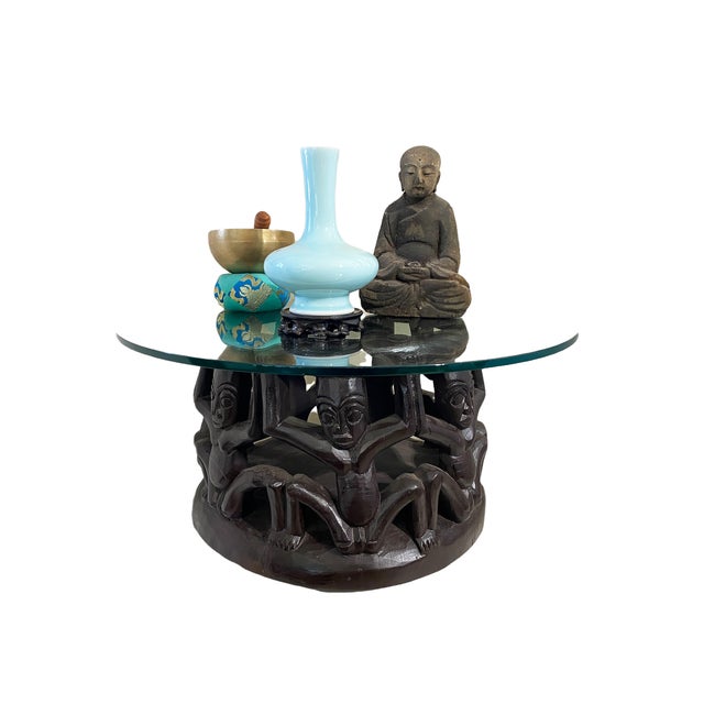 This exceptional vintage African Bamileke coffee table from Cameroon features a round, thick glass top measuring 25" in...