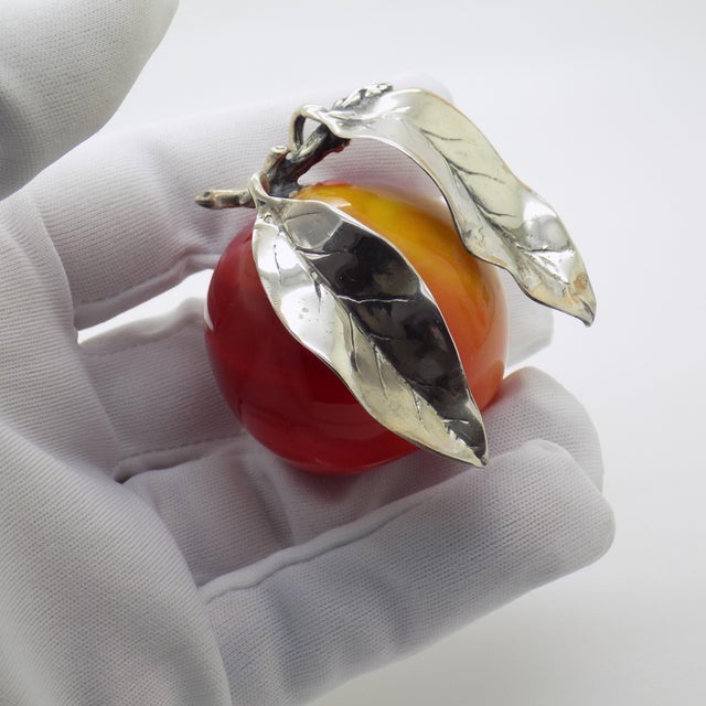 A vintage life-size sculpture depicting a plum, crafted in arezzo between the 1980s and 1990s in solid continental silver...