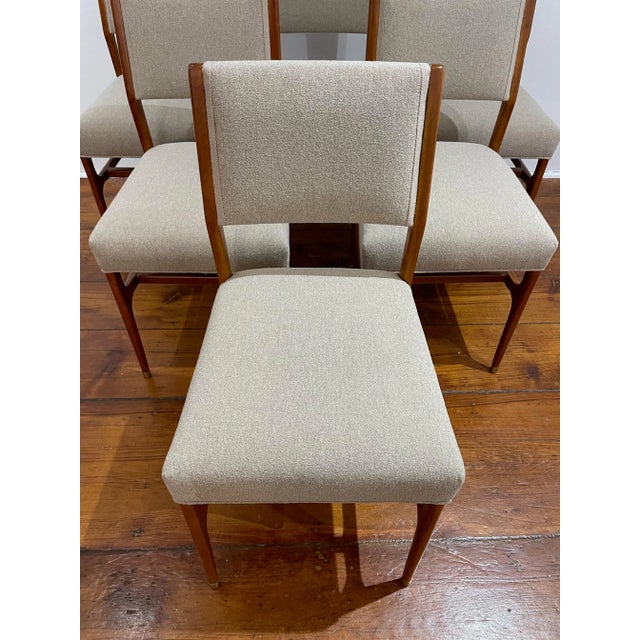 Set of six restored wooden chairs upholstered in camel Bouclè fabric designed atributted to Gio Ponti in the 1950s for the...