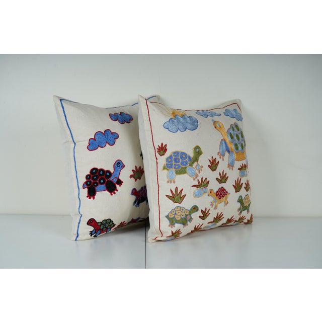 Uzbek Suzani Pillow Cover Elevate your home decor with our Turkish Suzani Pillow Cover, featuring exquisite vintage Uzbek...