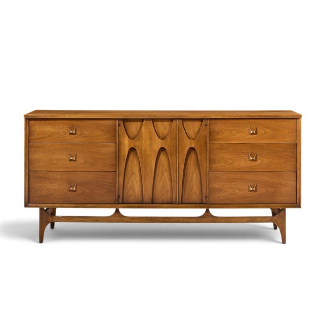 Broyhill Brasilia Mid Century Walnut and Brass 9 Drawer Lowboy Dresser This lowboy measures: 66 wide x 19 deep x 31 inches...