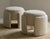 Vintage "wrap" pouf, France. This vintage ottoman has been newly reupholstered in a Cowtan & Tout off white textured...