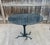 Contemporary dining table by Global Views. The "Faux Bois" table features an iron tree-like base with a black/gray granite...