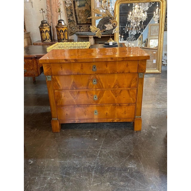 Very fine 19th century Austrian Empire walnut commode. Exceptional wood finish and superb quality. A truly elegant piece...