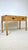 Vintage woven caning wrapped rattan campaign style console table. Woven caning with brass campaign hardware. Two drawers...