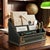 Three-tier letter holder dating to circa the 1960s, made from wood with a textured green leather-style covering and gold-...