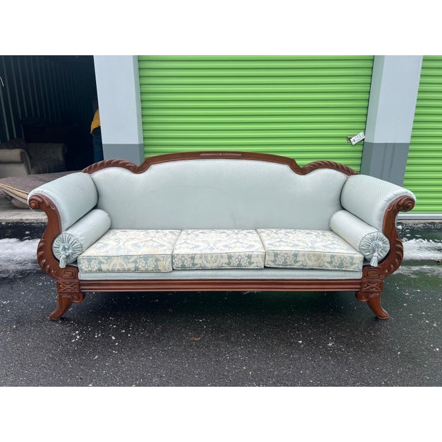 This elegant antique Victorian parlor sofa, often referred to as a Rococo Revival settee, dates to the late 19th century...