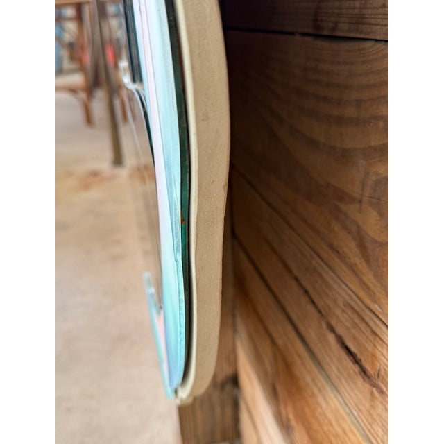 Striking vintage sculptural mirror by David Marshall featuring a pair of stylized parrots rendered in softly colored...