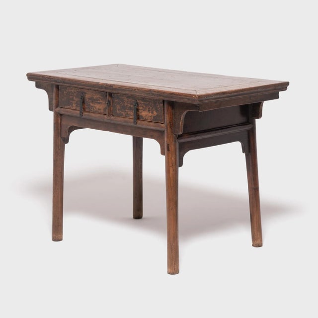 Crafted of northern elmwood in China's Shanxi province, this early 19th-century altar table was once used to display an...