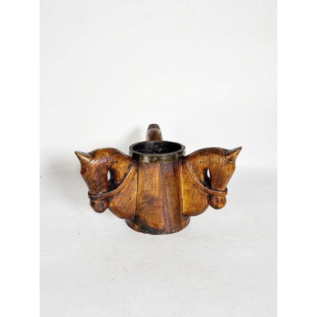 Carved wooden pencil holder with horse heads, France, 1960s, with an original and expressive design. This handcrafted...