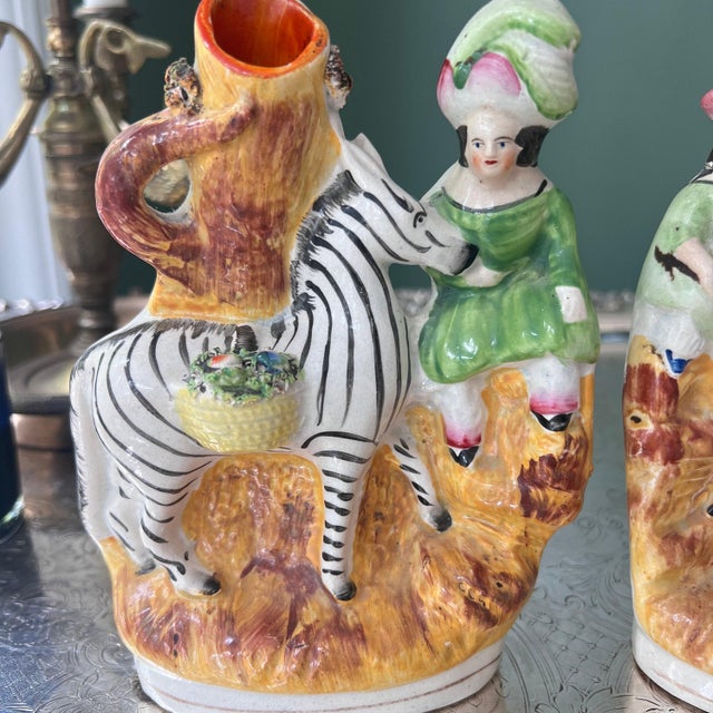 This is a lovely pair of antique Stafforshire in a sweet design that is very hard to find and is hand-painted in...
