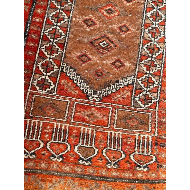 Beautiful mid century Turkmen Baluch rug with nice tribal and stylized design and beautiful colours, with orange, brown...