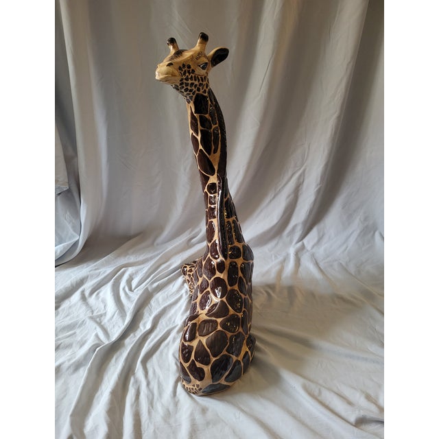 Large Vintage Glazed Ceramic Giraffe figure. This is a molded ceramic piece, with hand-painted details. Features a high...