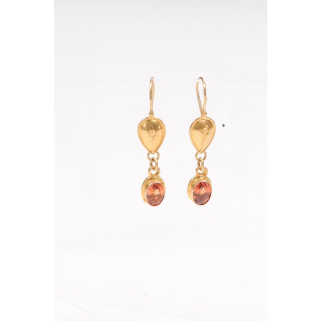 A stunning pair of 22 karat gold dangle earrings with Hessonite Garnet stones. These could be Greek or Etruscan inspired...