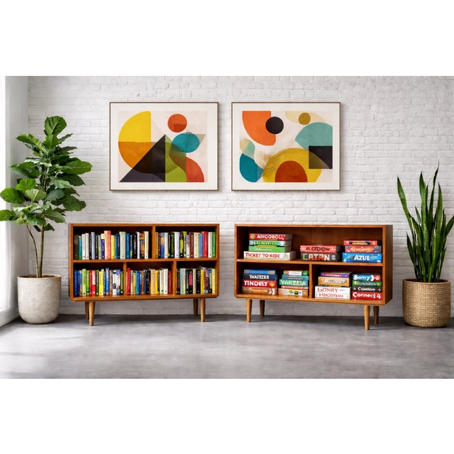 Mid Century Modern oak bookcase with clean lines, warm wood tones, and classic tapered legs in a timeless Danish design....